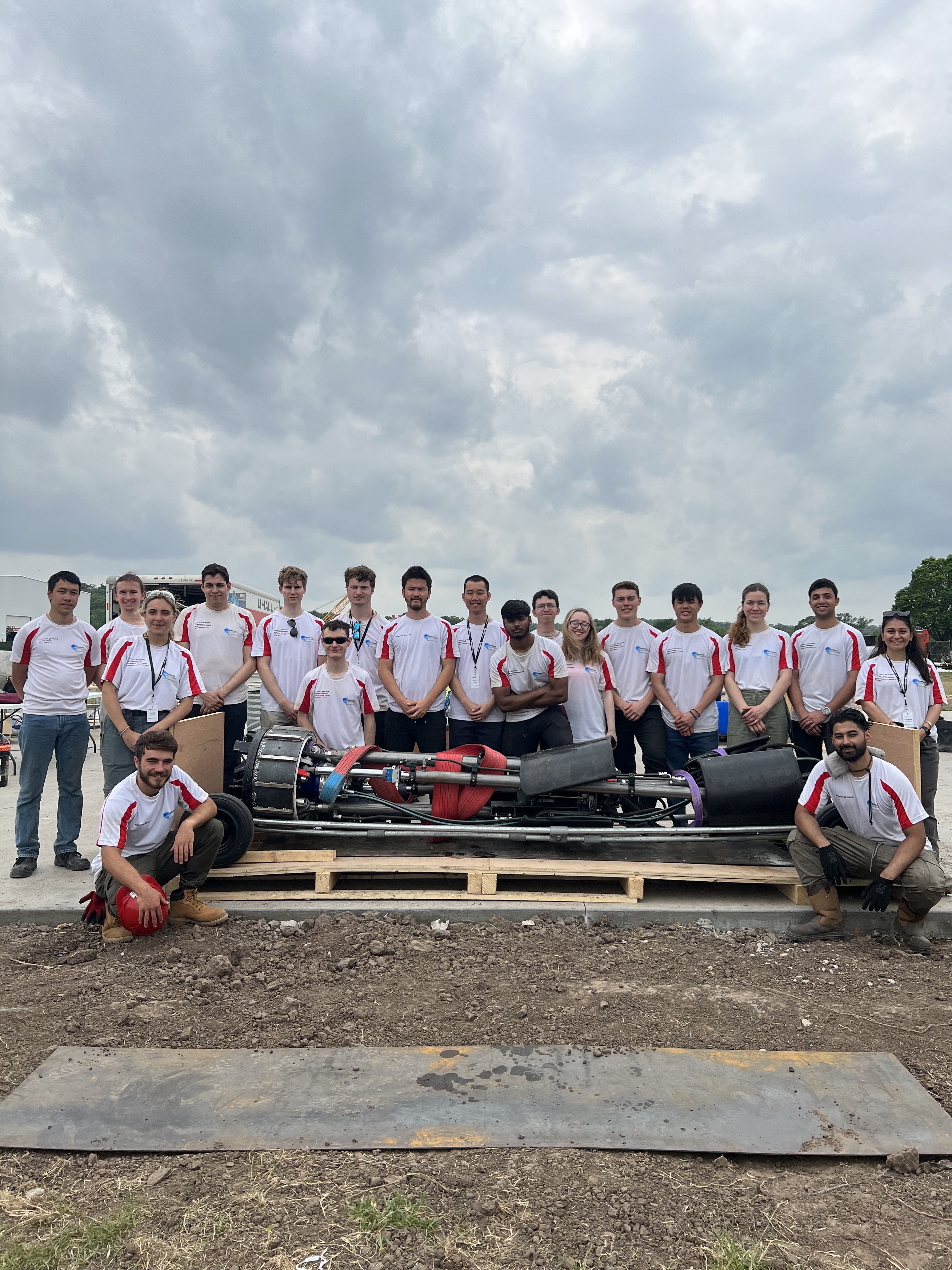 Hyperloop team with their pod at the test track