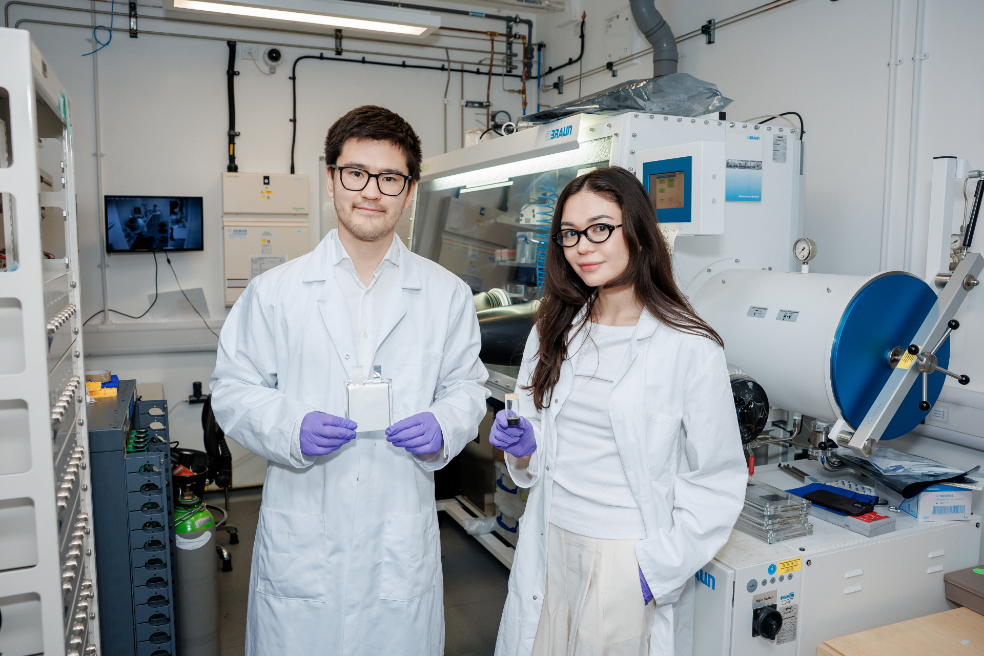 CEO Sanzhar Taizhan and COO Ainur Zhumasheva in the lab