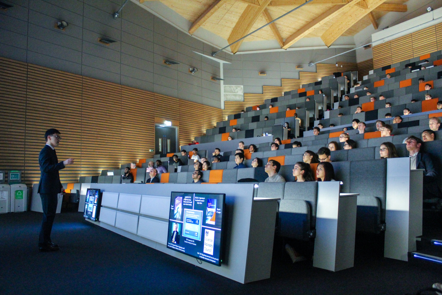 Sanzhar presenting Hyperloop research in a lecture theatre